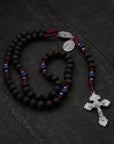 Handcrafted rosary honoring St. Carlo Acutis featuring wood beads, silver crucifix, and Miraculous Medal centerpiece