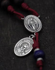 St. Carlo Acutis medal centerpiece detail on rosary with silver hardware and royal blue wooden beads