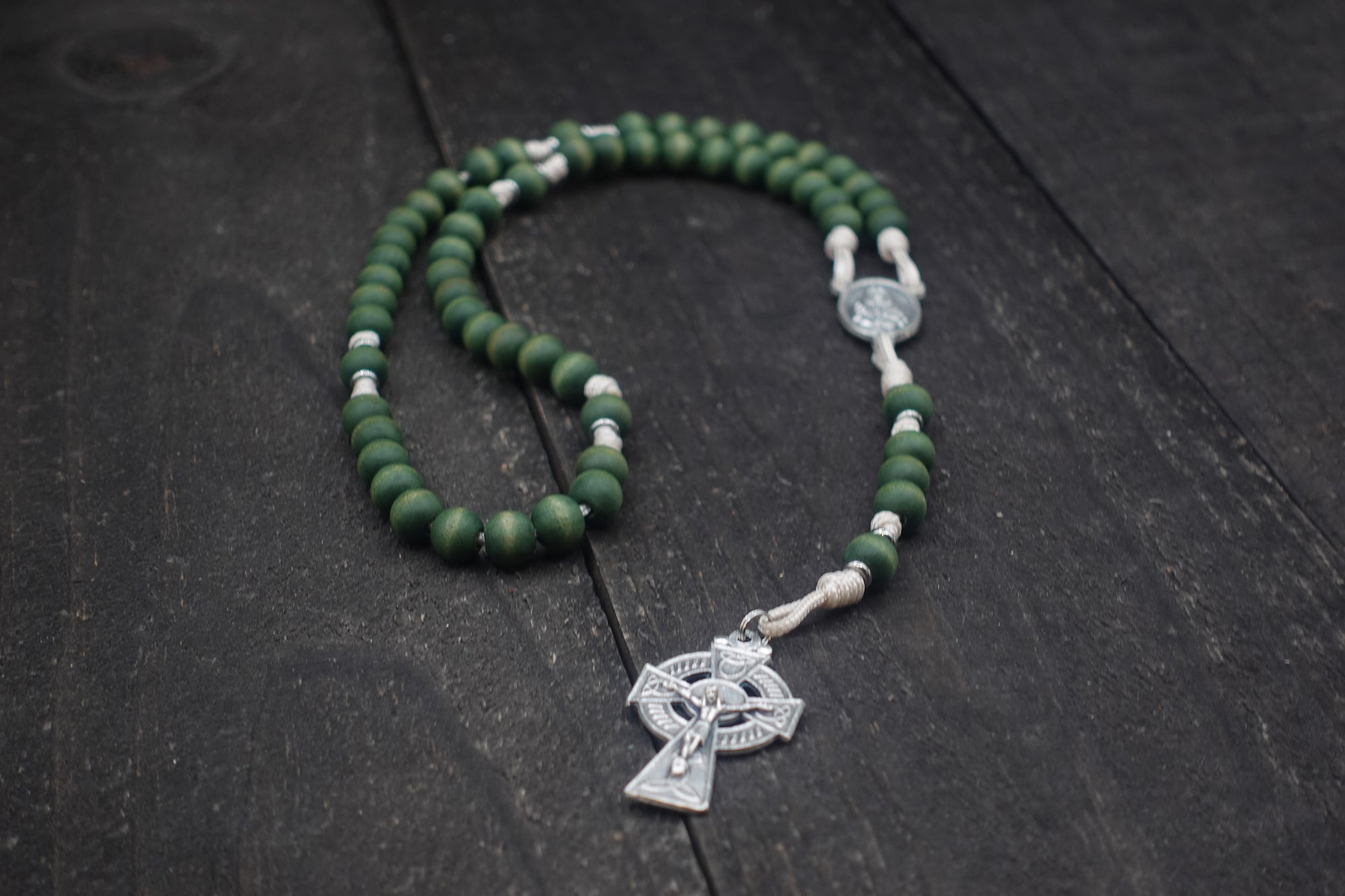 Handcrafted St. Dymphna rosary for daily prayer featuring silver crucifix and green wooden beads