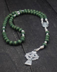 Handcrafted St. Dymphna rosary for daily prayer featuring silver crucifix and green wooden beads