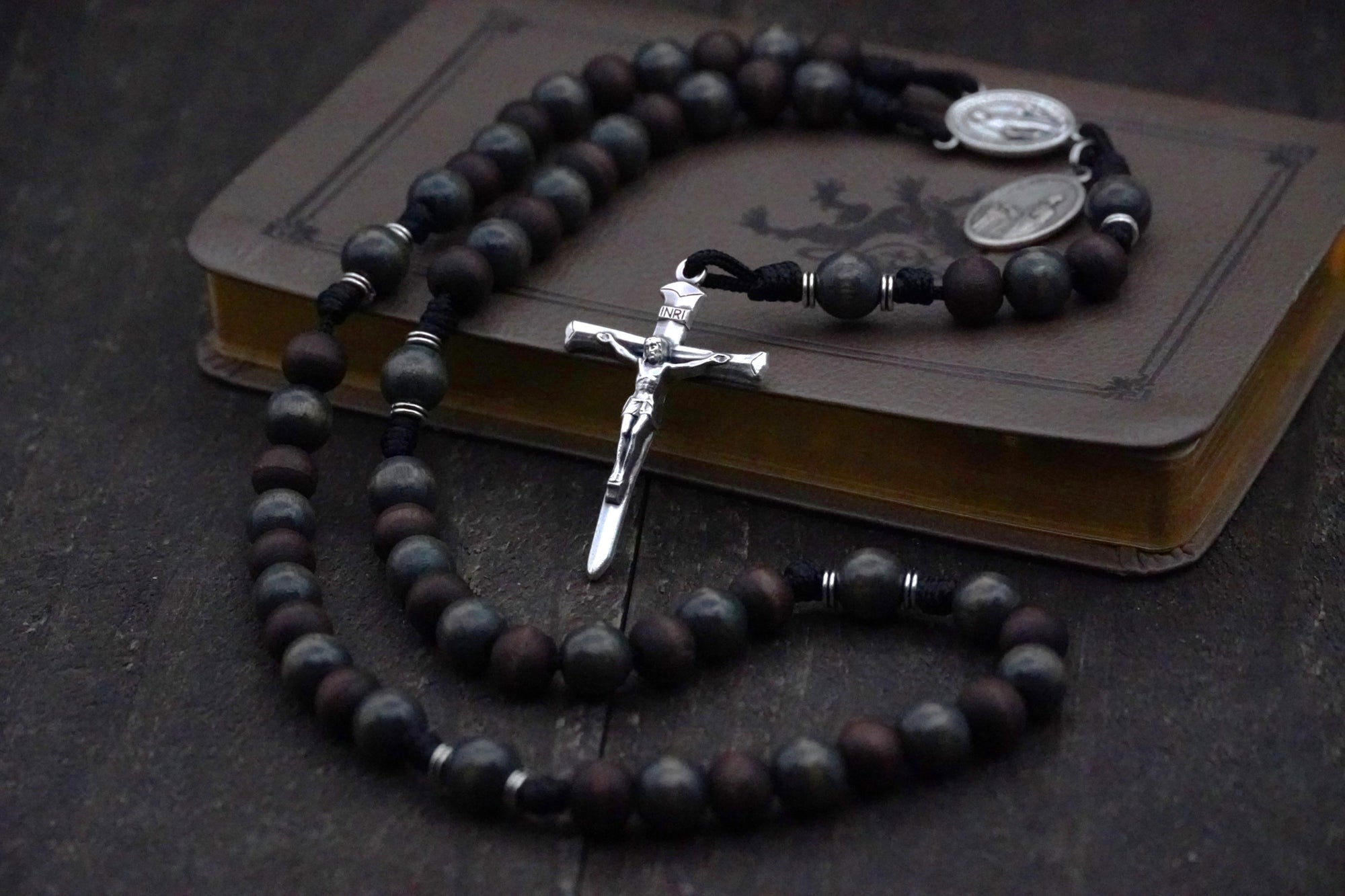 St. Ignatius of Loyola rosary with walnut and charcoal wooden beads, silver Nails crucifix, and black paracord
