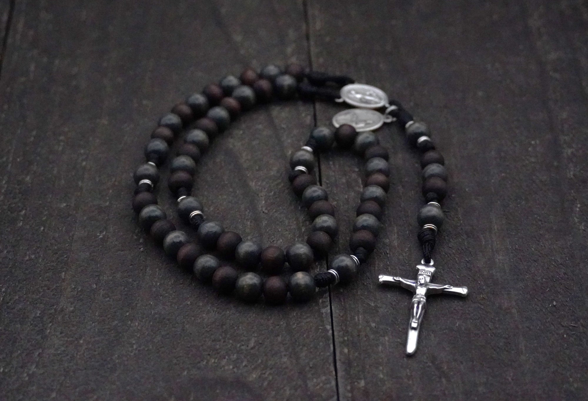 Handcrafted men’s rosary featuring walnut wood beads, silver crucifix, and Latin Miraculous Medal centerpiece