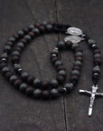Handcrafted men’s rosary featuring walnut wood beads, silver crucifix, and Latin Miraculous Medal centerpiece