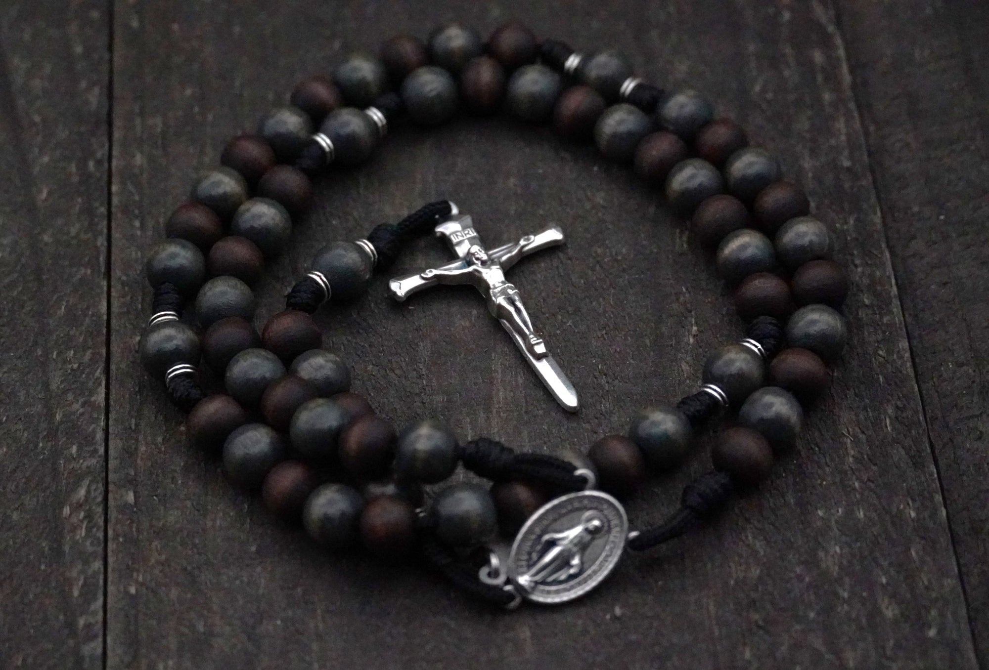 Rugged handmade St. Ignatius rosary crafted in Fargo ND with silver crucifix and walnut wood beads