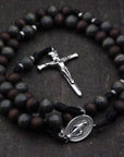 Rugged handmade St. Ignatius rosary crafted in Fargo ND with silver crucifix and walnut wood beads