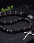 Handcrafted St. Ignatius rosary for Catholic men featuring silver crucifix and walnut wood beads