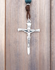 Silver crucifix detail symbolizing strength and faith on handmade St. Kateri Tekakwitha rosary