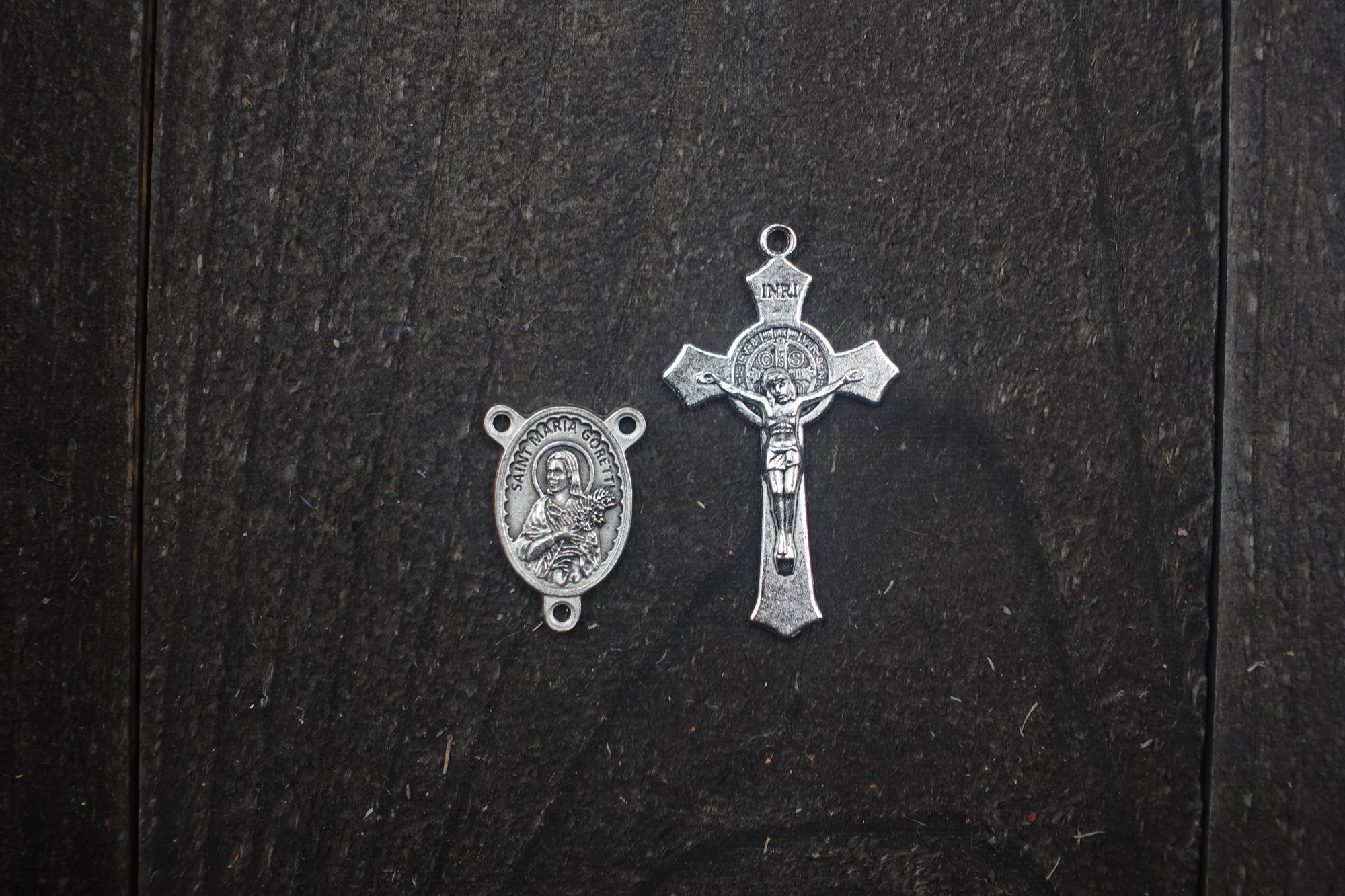 Silver crucifix detail symbolizing purity and faith on handmade St. Maria Goretti rosary