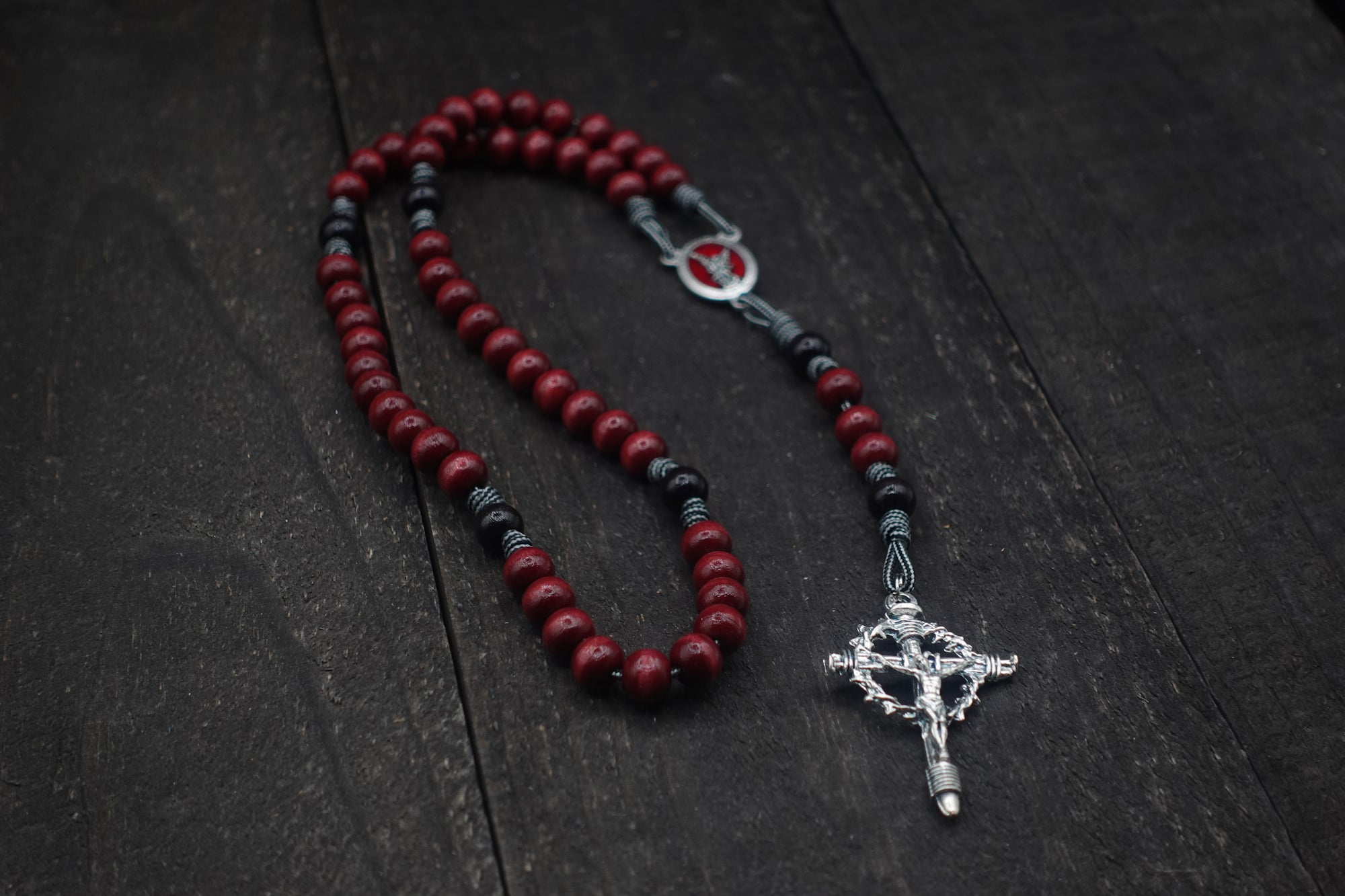 St. Michael rosary by Runewood Rosary combining red and black wood beads with silver crucifix for spiritual strength