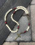 Handcrafted St. Nicholas Christmas rosary for daily prayer featuring bronze crucifix and wood beads
