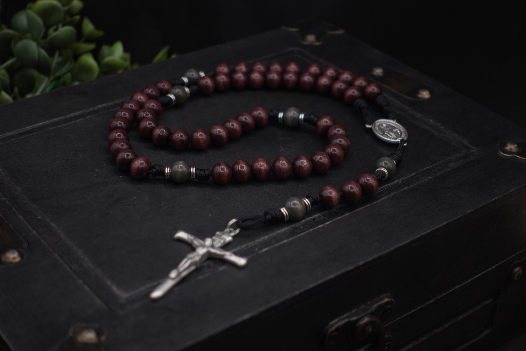 Terror of Demons rosary with purple and charcoal wooden beads, silver Nails crucifix, and durable black paracord