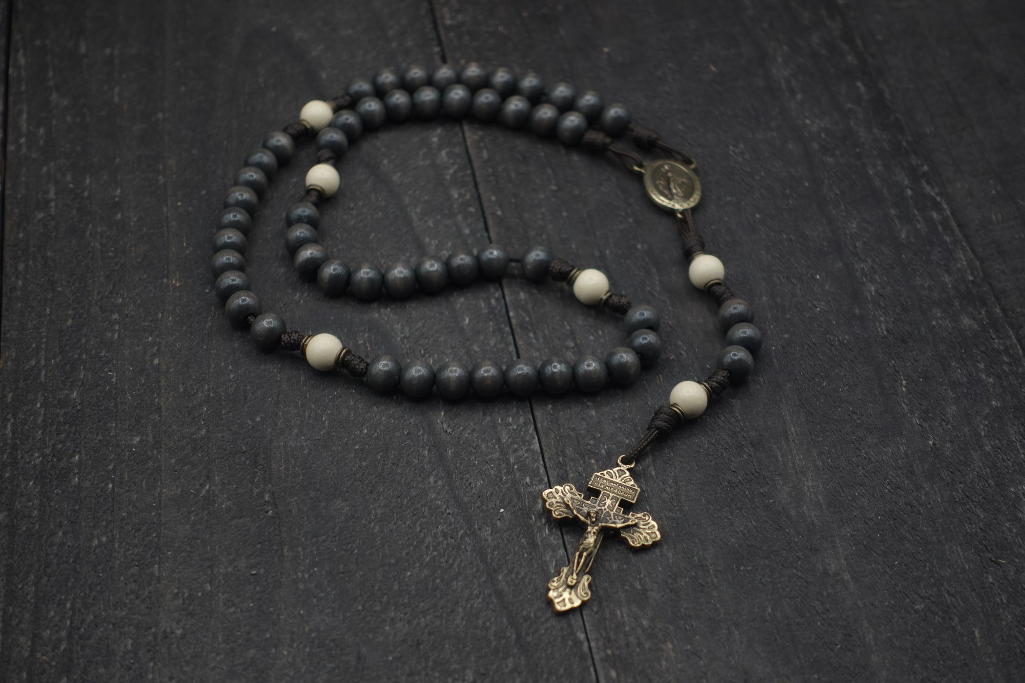 Rugged handmade Augustinian rosary crafted in Fargo ND with bronze crucifix and white Our Father beads