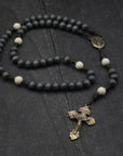 Rugged handmade Augustinian rosary crafted in Fargo ND with bronze crucifix and white Our Father beads