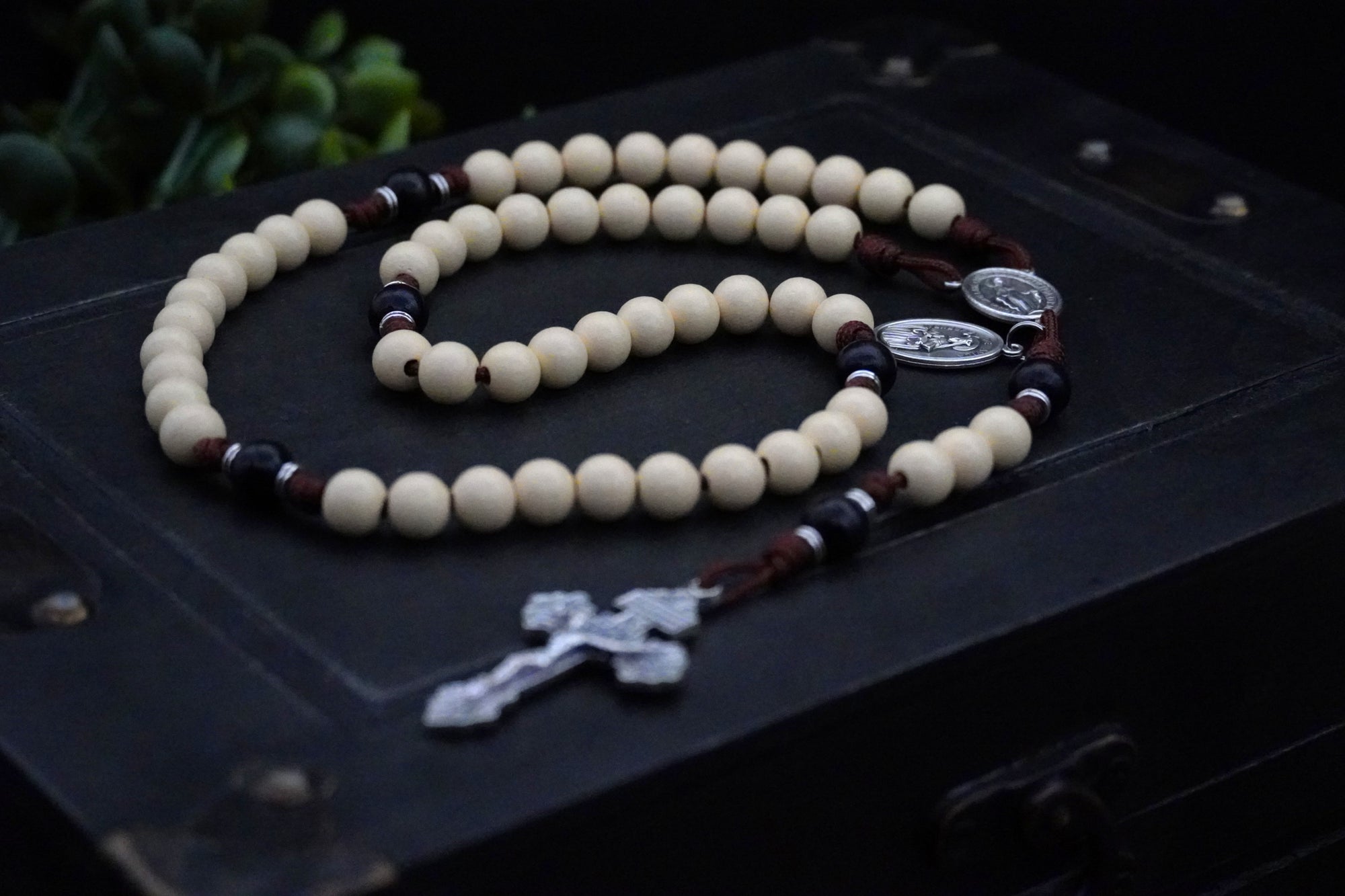 Handcrafted St. Teresa of Ávila rosary for daily prayer featuring silver crucifix and vintage white wooden beads