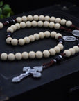 Handcrafted St. Teresa of Ávila rosary for daily prayer featuring silver crucifix and vintage white wooden beads